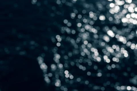 Bokeh effect.The bokeh of the lens from the surface of the water shimmering i Stock Photos