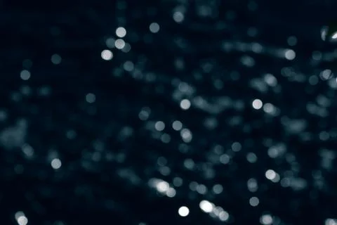 Bokeh effect.The bokeh of the lens from the surface of the water shimmering i Stock Photos