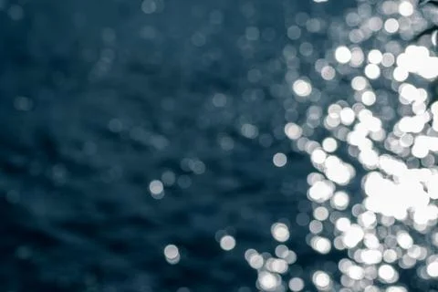 Bokeh effect.The bokeh of the lens from the surface of the water shimmering i Stock Photos