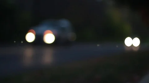 Bokeh Effect Car Headlights at Dusk Stock Footage 75035173