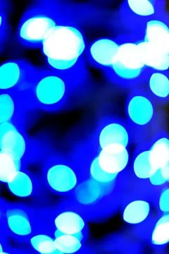 Bokeh effect of colored lights on black background Stock Photos