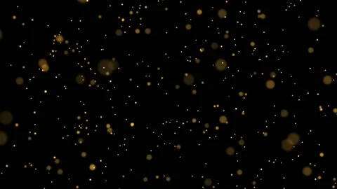 Bokeh effect with golden particles and blurred shiny dust on black background Video stock 141003115
