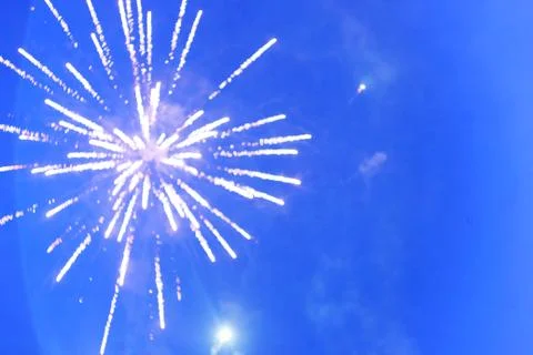 Bokeh firework on bright blue sky background Stock Photos