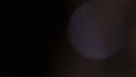 Bokeh glow of a single number on the right side of the blue color Stock-Footage 309290236