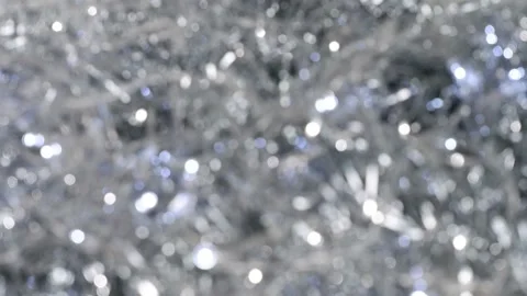 Bokeh. Glowing silver defocused lights. Christmas background. Stock Footage 159488281