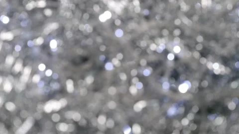 Bokeh. Glowing silver defocused lights. Christmas background. Video stock 159816401