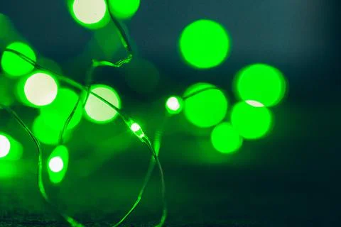 Bokeh of green garland lighting elements background Stock Photos
