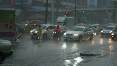 Bokeh headlights blur during heavy rainstorm on asphalt road ,Abstract back.. Stock Footage 234168002