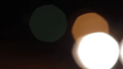 Bokeh headlights moving out of frame with moving brake lights Stock Footage 83800223