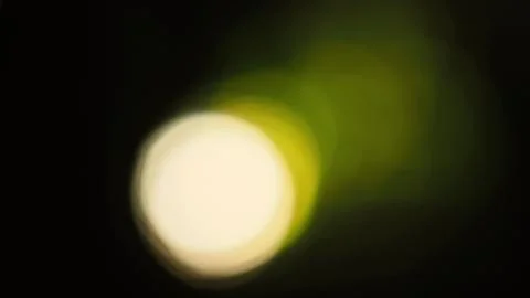 Bokeh images circle bubbles shape yellow color on black background. Stock Photos