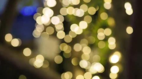 Bokeh images circle bubbles shape yellow color on black background. Stock Photos