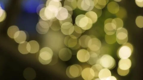 Bokeh images circle bubbles shape yellow color on black background. Stock Photos