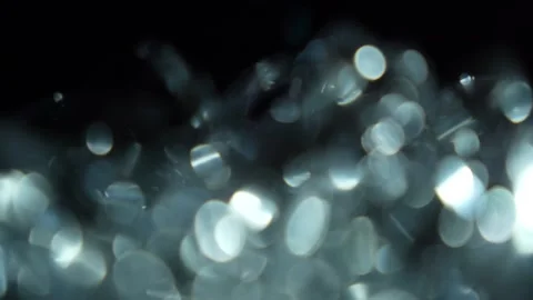 Bokeh in large numbers without focus and moving to the right Stock Footage 315320385
