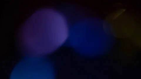 Bokeh leak in abstract style on soft black background. 動画素材 100073992