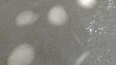 Bokeh light and shadow leaks on marble tile surface Stock Footage 338372431