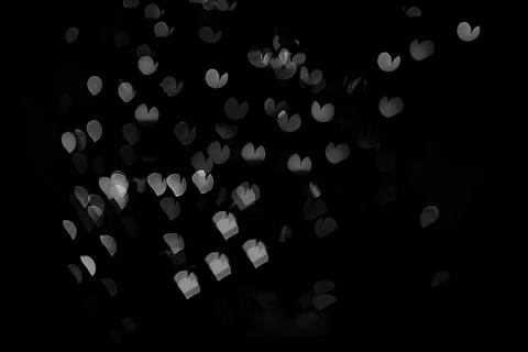 Bokeh of light in the form of bright colored hearts Stock Photos