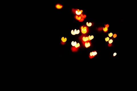 Bokeh of light in the form of bright colored hearts Stock Photos