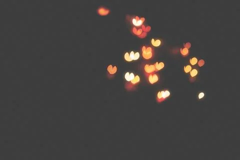 Bokeh of light in the form of bright colored hearts Stock Photos