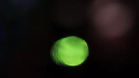 Bokeh light leak ring flashing on dark background 스톡 동영상 317459086