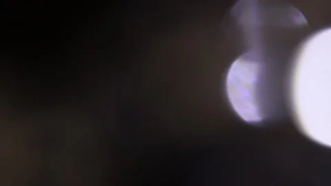 Bokeh light leak video on black background 스톡 동영상 309325625