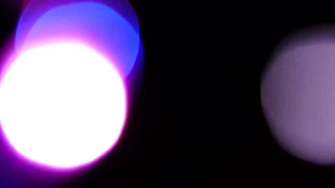 Bokeh light movement, multi-colored flashing lines in the dark 스톡 동영상 309427430