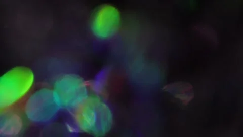 Bokeh light penetrates the frames against a black background. Stock Footage 317481182