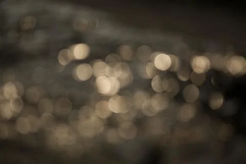 Bokeh of light reflected on water. 写真素材