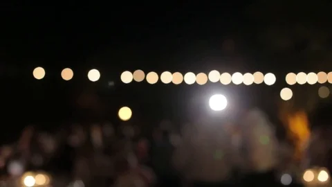 Bokeh Lighting with Wedding Party Dancing at Night Stock Footage 76356261