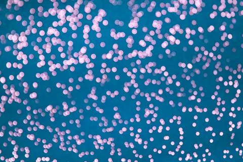 Bokeh lights background. Defocused light circles on blue background. Blue magic Stock Photos