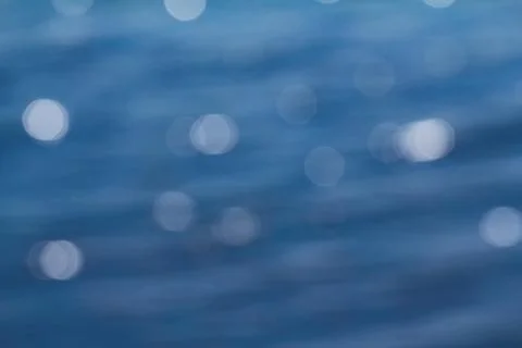 Bokeh lights On Blue Background. Stock Photos