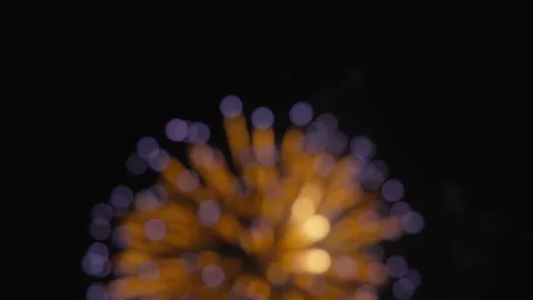 Bokeh lights of colorful fireworks exploding in the night sky Video stock 319806106