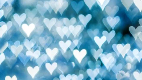 Bokeh of lights on defocused background in a form of heart Stock Photos