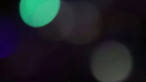 Bokeh lights with different colors move on door handles in the dark. Video stock 309762234