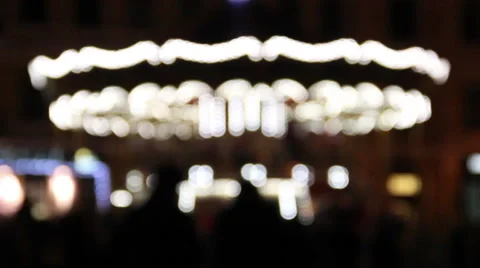 Bokeh lights of moving carousel on Christmas market Stock Footage 58059744
