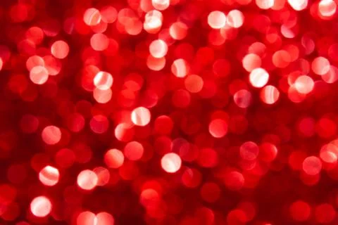 Bokeh lights red texture. New year background. Stock Photos