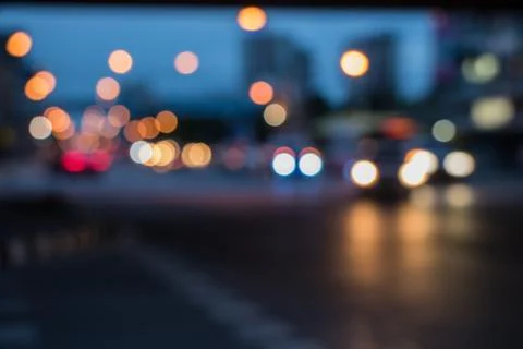 Bokeh lights from the tail lights at the intersection at night. Stock Photos