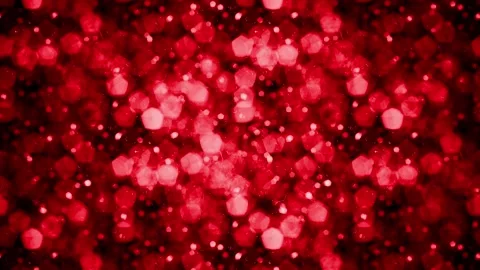 Bokeh lights in warm orange and deep red hues with subtle particle effects Видео 342922209