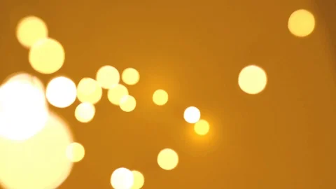 Bokeh of lights on yellow background Stock Footage 107495251
