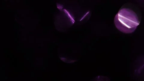 Bokeh of medium ring lights from the upper side of the black Stock Footage 318945839