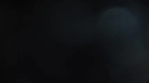 Bokeh movement flickering in the dark Stock Footage 315320125
