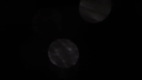Bokeh moves downward with low white light 스톡 동영상 318730628