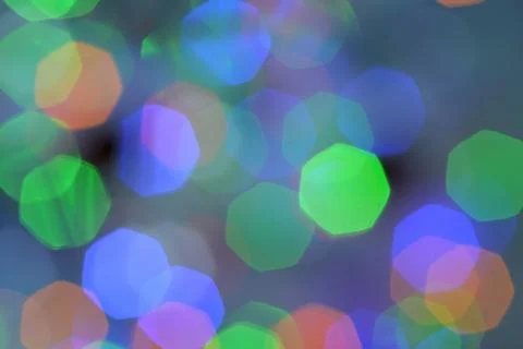 Bokeh from multifaceted multi-colored night lights with blur background. Stock Photos