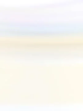 Bokeh neutral light almost white universal background. White gentle pastel sk 库存照片