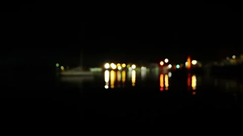 Bokeh - Night lights are reflected on the lake Stock Footage 255507339