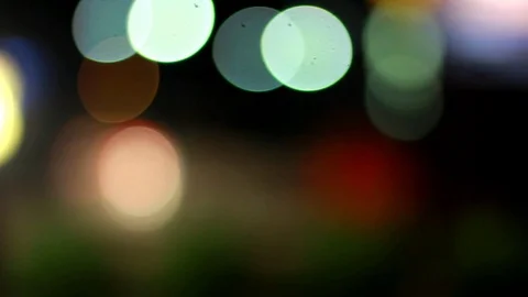 Bokeh or out of focus lights coming from traffic on the road. Stock-Footage 106282055