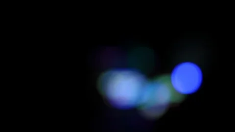 Bokeh pan shot of defocused blinking carnival lights Stock Footage 120138461