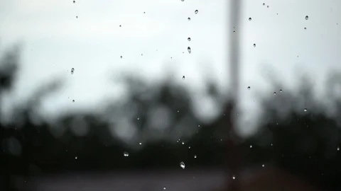 Bokeh Rain Falling Hard Against a Cloudy Sky in the Country Video stock 123946658