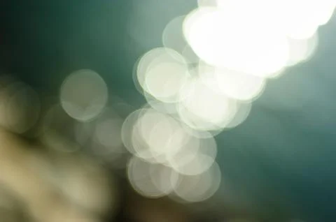 Bokeh of reflected light on sea Stock Photos