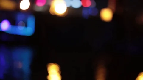 Bokeh from river bus floating on the waves at night. Stock-Footage 77232759