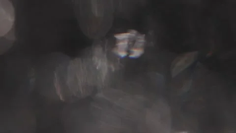 Bokeh rotating video of full-screen crystal bokeh celebration on a black backgro Stock Footage 317479818